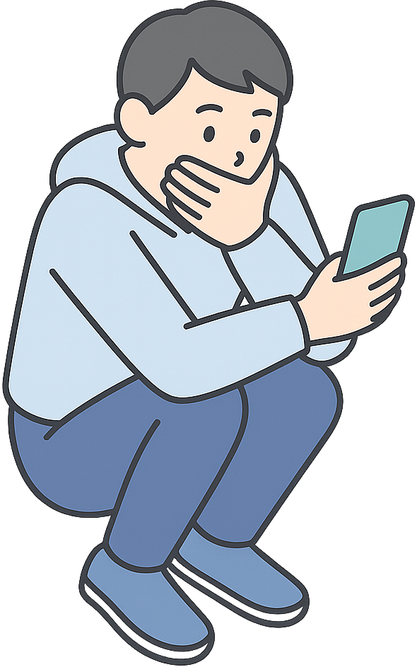 隠れてスマホを使っている男性